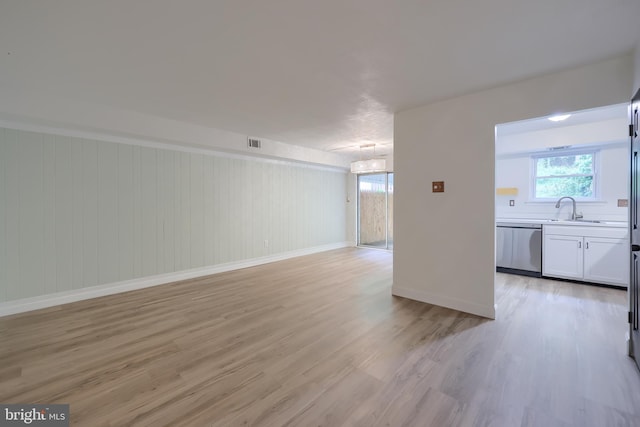 1134 Fox Run, Reading, PA 19606 - unfurnished living room featuring light wood-type flooring, baseboards, and a sink