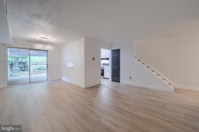 1134 Fox Run, Reading, PA 19606 - unfurnished room with light wood-type flooring, stairs, and baseboards