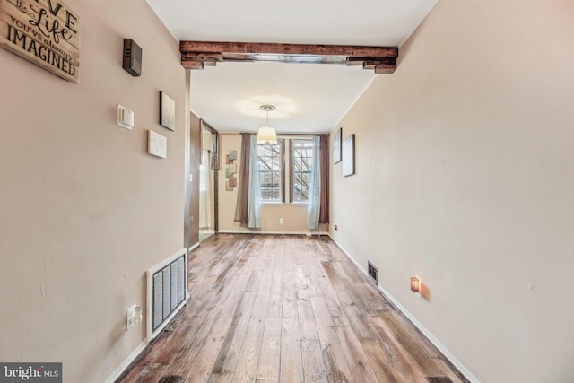 904 N Rosedale St, Baltimore, MD 21216 - corridor featuring beam ceiling, hardwood / wood-style flooring, and baseboards