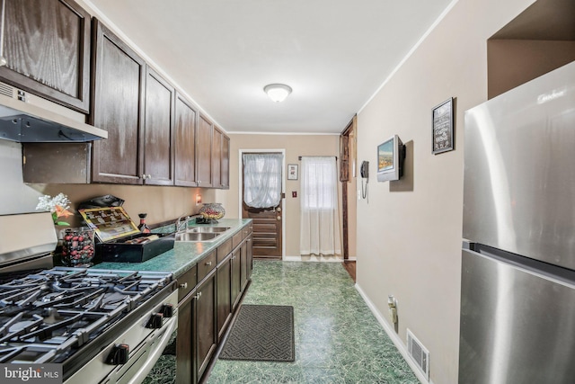 904 N Rosedale St, Baltimore, MD 21216 - kitchen featuring appliances with stainless steel finishes, a sink, under cabinet range hood, dark brown cabinets, and tile patterned floors
