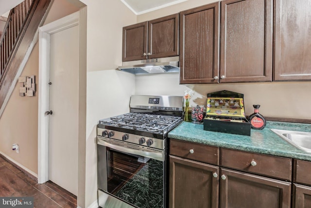 904 N Rosedale St, Baltimore, MD 21216 - kitchen featuring stainless steel range with gas cooktop, under cabinet range hood, dark brown cabinetry, and dark wood-style floors