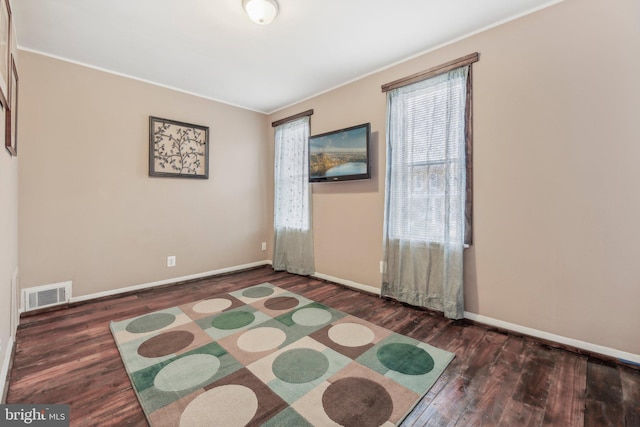 904 N Rosedale St, Baltimore, MD 21216 - spare room with wood finished floors, ornamental molding, and baseboards