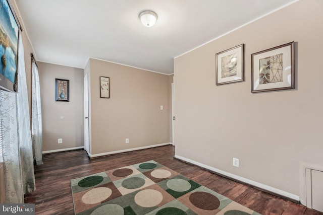 904 N Rosedale St, Baltimore, MD 21216 - empty room with wood finished floors and baseboards