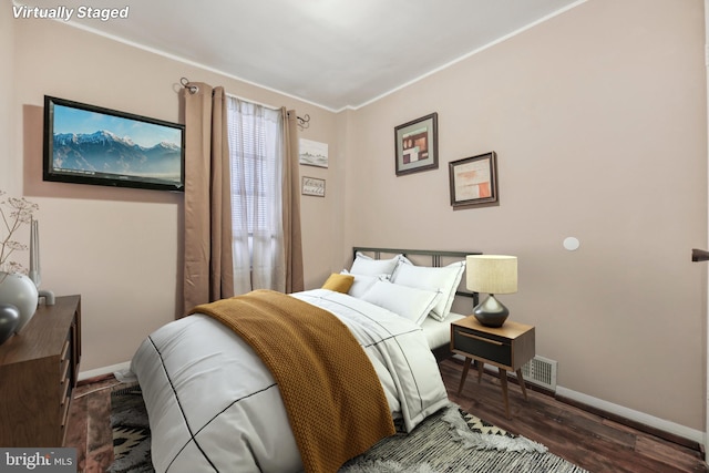 904 N Rosedale St, Baltimore, MD 21216 - bedroom with baseboards and wood finished floors