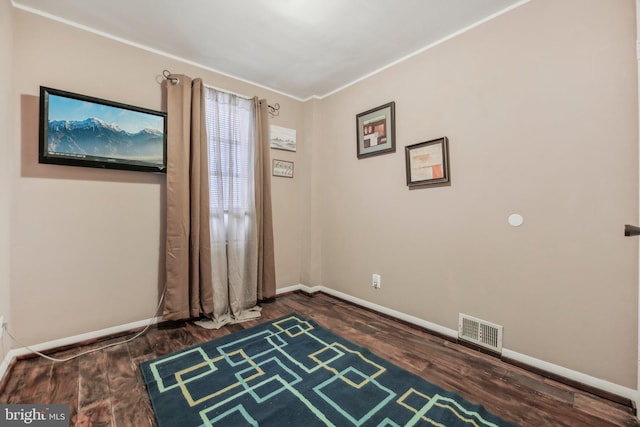 904 N Rosedale St, Baltimore, MD 21216 - spare room featuring baseboards, wood finished floors, and ornamental molding