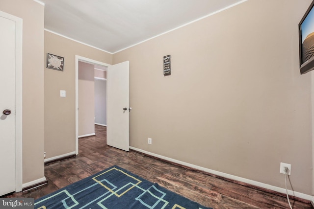 904 N Rosedale St, Baltimore, MD 21216 - empty room with wood finished floors, baseboards, and crown molding