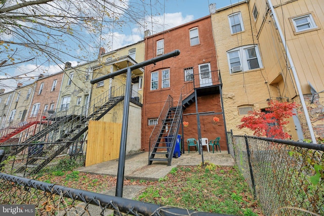 904 N Rosedale St, Baltimore, MD 21216 - rear view of property featuring stairway