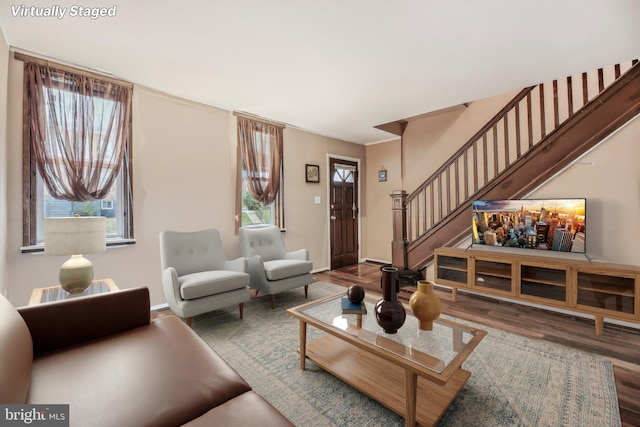 904 N Rosedale St, Baltimore, MD 21216 - living area with wood finished floors, stairway, and baseboards
