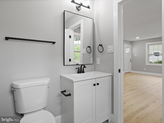 5105 11th St S, Arlington, VA 22204 - half bathroom featuring toilet, vanity, wood finished floors, plenty of natural light, and recessed lighting