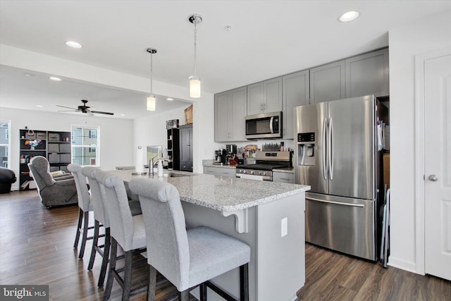 215 Homestead Dr, Hanover, PA 17331 - kitchen with stainless steel appliances, recessed lighting, a kitchen breakfast bar, gray cabinets, and a ceiling fan