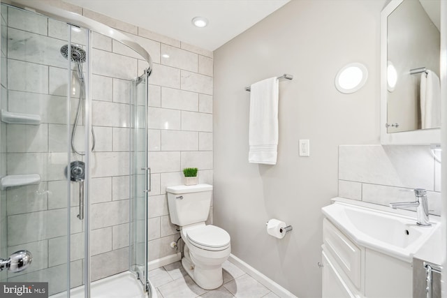 3117 Port Way, Annapolis, MD 21403 - bathroom with vanity, a stall shower, toilet, tile patterned floors, and tile walls
