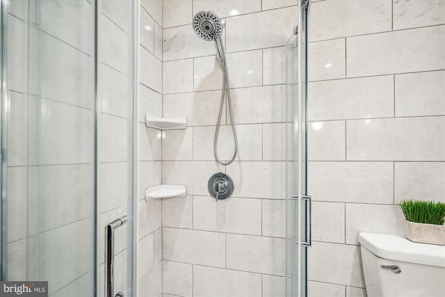 3117 Port Way, Annapolis, MD 21403 - bathroom featuring a stall shower, toilet, and tile walls