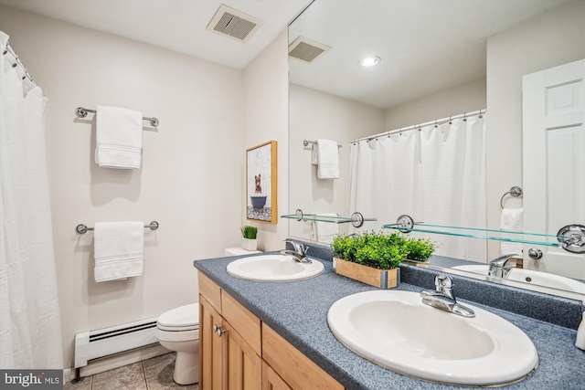 3117 Port Way, Annapolis, MD 21403 - bathroom with a baseboard heating unit, toilet, double vanity, tile patterned floors, and recessed lighting