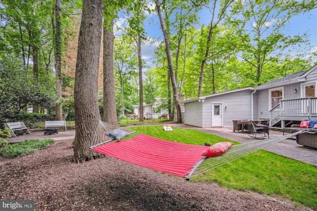 3117 Port Way, Annapolis, MD 21403 - view of green lawn featuring a patio, an outdoor fire pit, and a wooden deck