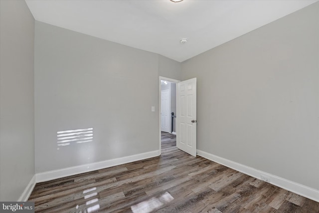 405 N Loudon Ave, Baltimore, MD 21229 - empty room with wood finished floors and baseboards