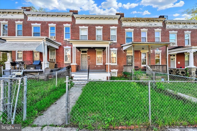 405 N Loudon Ave, Baltimore, MD 21229 - view of property featuring brick siding and covered porch
