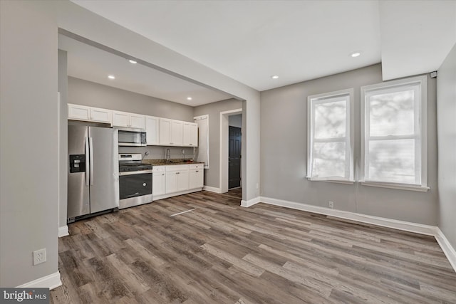 405 N Loudon Ave, Baltimore, MD 21229 - kitchen with stainless steel appliances, baseboards, white cabinetry, dark wood-style flooring, and recessed lighting