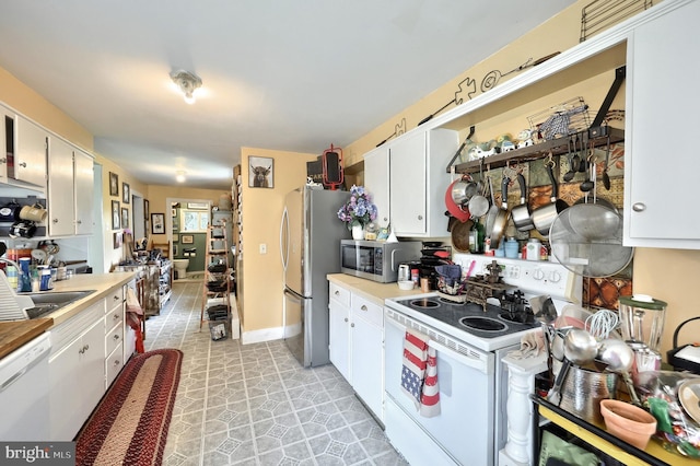 2241 Craley Rd, Windsor, PA 17366 - kitchen featuring appliances with stainless steel finishes, light countertops, and white cabinetry