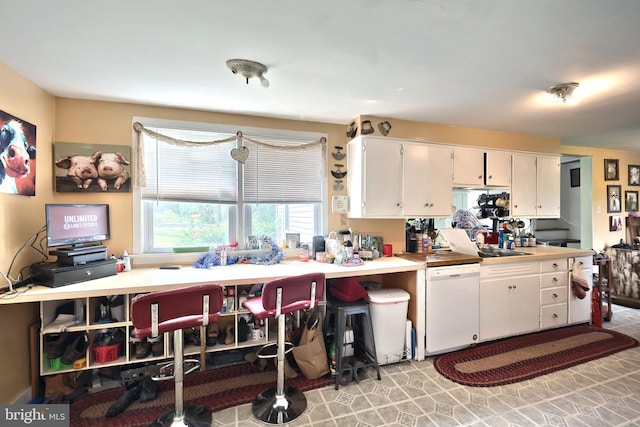 2241 Craley Rd, Windsor, PA 17366 - kitchen featuring dishwasher, white cabinets, a sink, and light countertops
