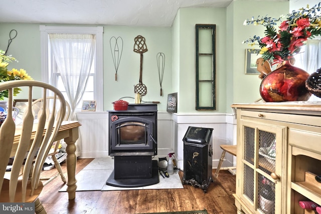 2241 Craley Rd, Windsor, PA 17366 - detailed view of a wood stove, wood finished floors, and a wainscoted wall