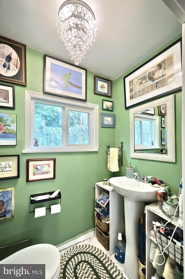 2241 Craley Rd, Windsor, PA 17366 - bathroom featuring toilet, a chandelier, and baseboards