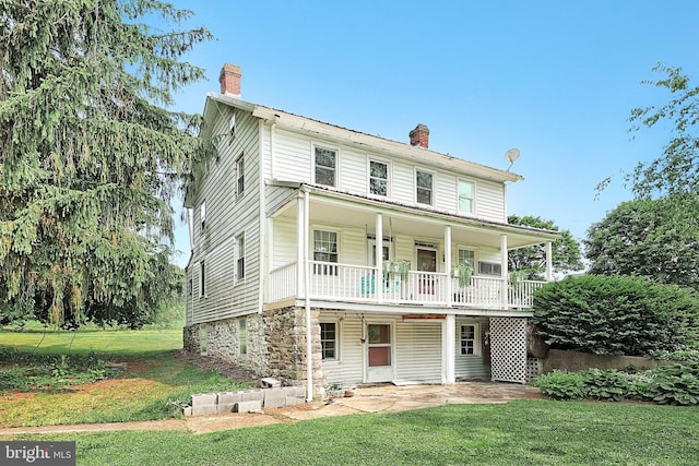 2241 Craley Rd, Windsor, PA 17366 - view of front of home with a chimney, a front lawn, and a patio area