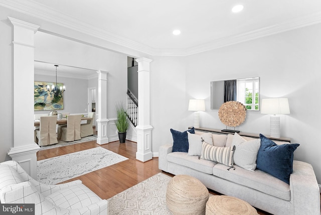 41311 Silverside Dr, Leesburg, VA 20175 - living area featuring ornate columns, ornamental molding, wood finished floors, stairs, and recessed lighting