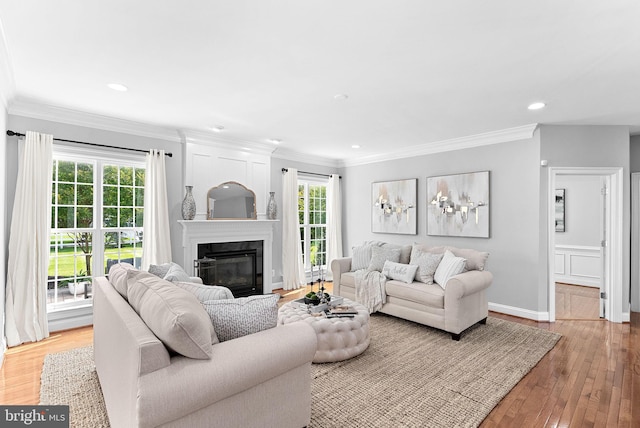 41311 Silverside Dr, Leesburg, VA 20175 - living room with light wood-style floors, plenty of natural light, a premium fireplace, crown molding, and recessed lighting