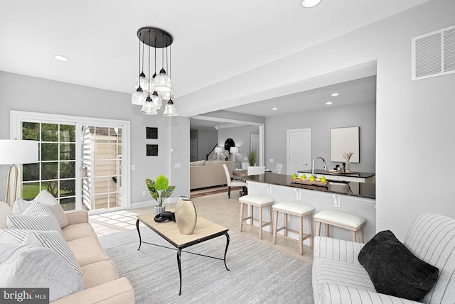 41311 Silverside Dr, Leesburg, VA 20175 - living room featuring recessed lighting, a chandelier, and baseboards