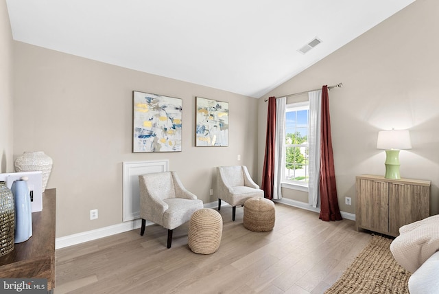 41311 Silverside Dr, Leesburg, VA 20175 - sitting room featuring light wood-style flooring, baseboards, and lofted ceiling