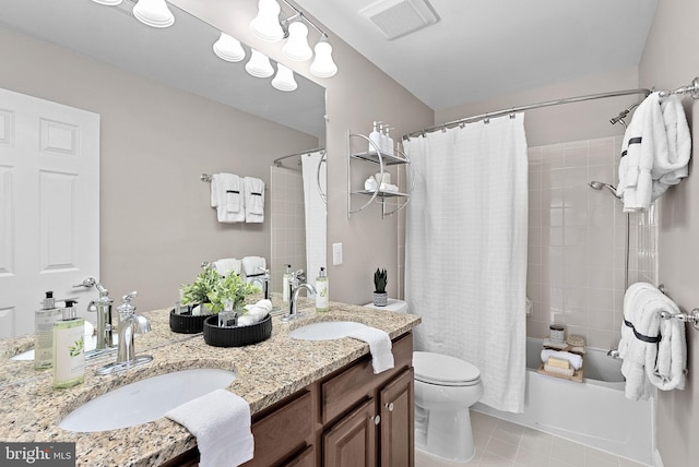 41311 Silverside Dr, Leesburg, VA 20175 - full bath with double vanity, toilet, shower / tub combo, and tile patterned floors