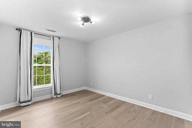 41311 Silverside Dr, Leesburg, VA 20175 - spare room featuring light wood-style floors and baseboards
