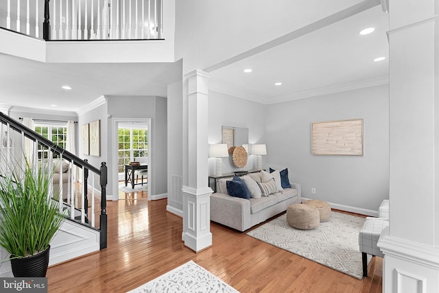 41311 Silverside Dr, Leesburg, VA 20175 - living room with ornate columns, crown molding, baseboards, wood finished floors, and recessed lighting