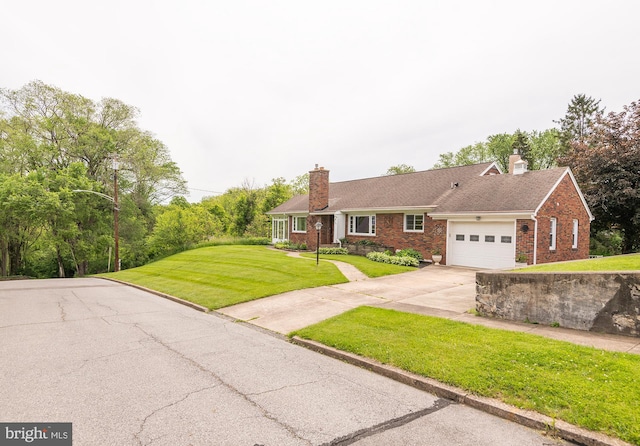 724 E Curtin St, Bellefonte, PA 16823 - ranch-style home with brick siding, driveway, a garage, a front lawn, and a chimney