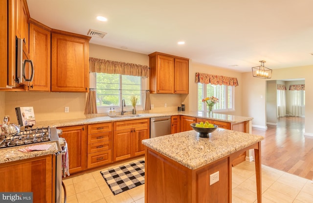 724 E Curtin St, Bellefonte, PA 16823 - kitchen with appliances with stainless steel finishes, a sink, a peninsula, healthy amount of natural light, and recessed lighting