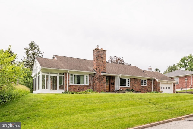 724 E Curtin St, Bellefonte, PA 16823 - ranch-style house featuring a garage, brick siding, a chimney, and a front yard