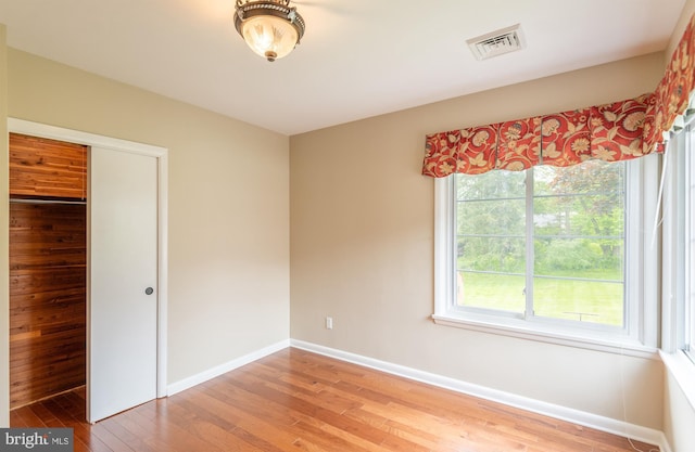724 E Curtin St, Bellefonte, PA 16823 - unfurnished bedroom featuring wood finished floors, baseboards, and a closet