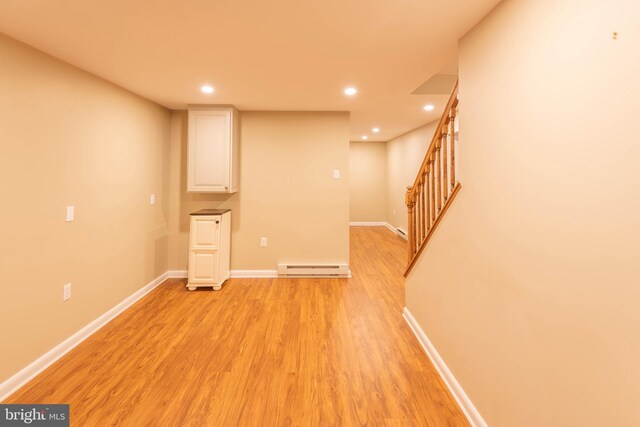 724 E Curtin St, Bellefonte, PA 16823 - finished below grade area featuring baseboard heating, light wood-type flooring, stairway, recessed lighting, and baseboards
