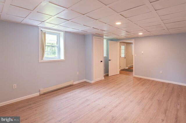 724 E Curtin St, Bellefonte, PA 16823 - below grade area with baseboard heating, baseboards, light wood-type flooring, and recessed lighting