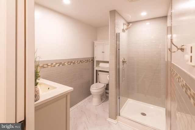 724 E Curtin St, Bellefonte, PA 16823 - full bath with tile walls, a stall shower, vanity, marble finish floors, and toilet