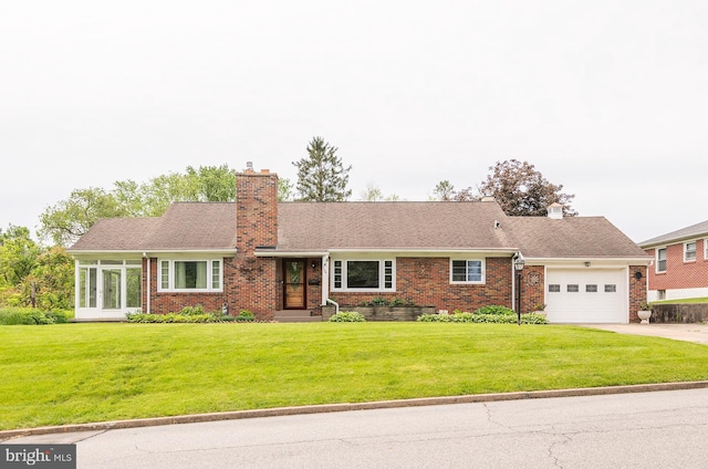 724 E Curtin St, Bellefonte, PA 16823 - ranch-style house with concrete driveway, an attached garage, brick siding, a chimney, and a front yard