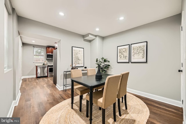 1402 W Lombard St, Baltimore, MD 21223 - dining room featuring dark wood-style flooring, recessed lighting, and baseboards