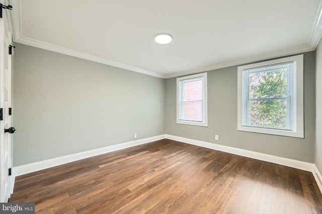 1402 W Lombard St, Baltimore, MD 21223 - unfurnished room featuring crown molding, baseboards, and dark wood-style flooring