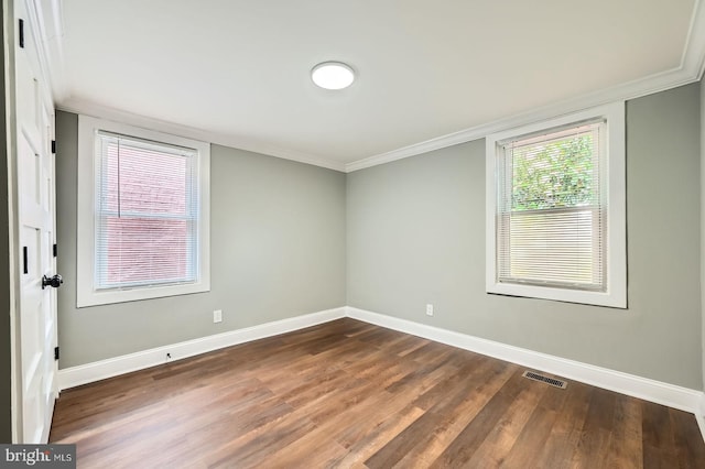 1402 W Lombard St, Baltimore, MD 21223 - spare room with baseboards, dark wood finished floors, and ornamental molding