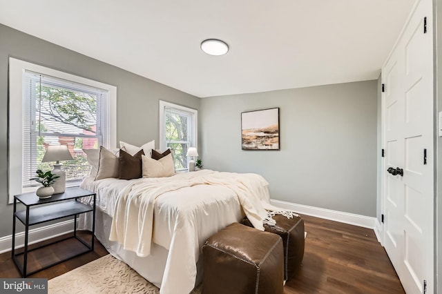 1402 W Lombard St, Baltimore, MD 21223 - bedroom featuring baseboards and dark wood-type flooring
