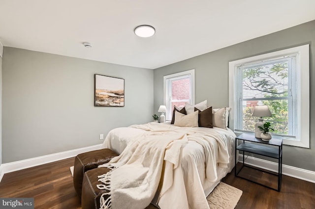 1402 W Lombard St, Baltimore, MD 21223 - bedroom featuring baseboards and dark wood-style floors