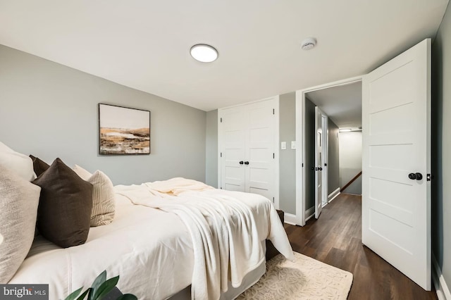 1402 W Lombard St, Baltimore, MD 21223 - bedroom featuring dark wood-type flooring, a closet, and baseboards