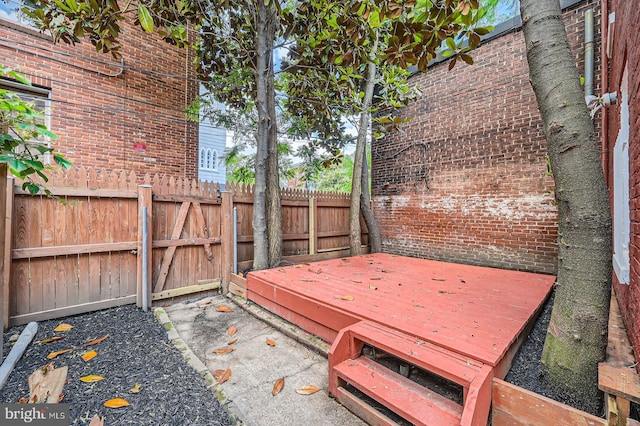 1402 W Lombard St, Baltimore, MD 21223 - fenced backyard with a deck