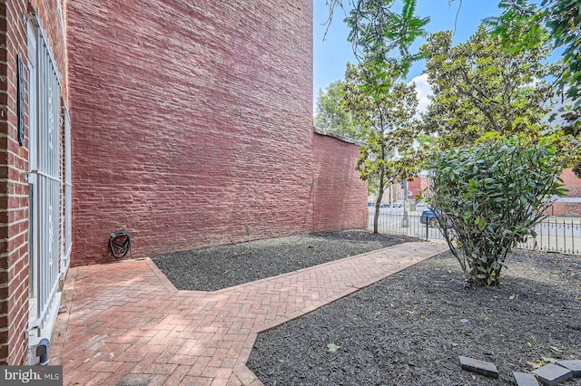 1402 W Lombard St, Baltimore, MD 21223 - view of property exterior featuring brick siding