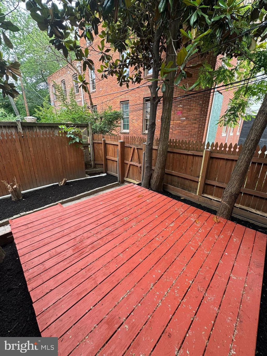 1402 W Lombard St, Baltimore, MD 21223 - wooden terrace featuring a fenced backyard